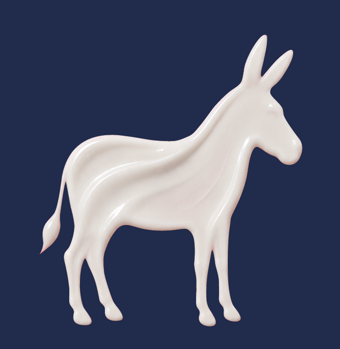 An ivory cream sculpture in the shape of a donkey
