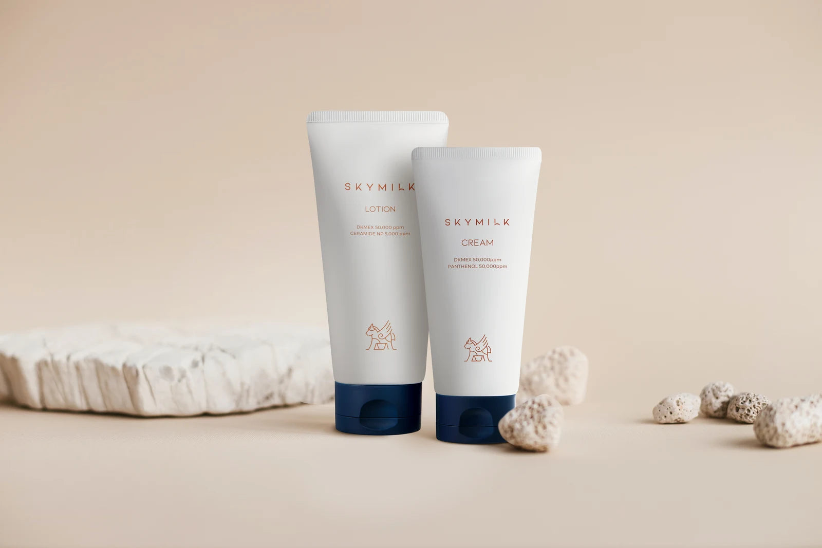 SKYMILK Cream and Lotion together on a warm stone setting